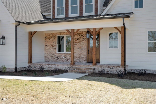 321 Bud Wall Rd, Youngsville, NC 27596 - entrance to property featuring a yard, covered porch, metal roof, and a standing seam roof