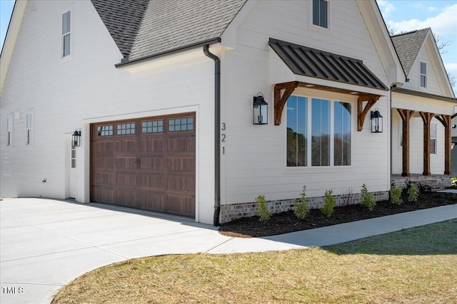 321 Bud Wall Rd, Youngsville, NC 27596 - view of property exterior with a garage, driveway, and a shingled roof
