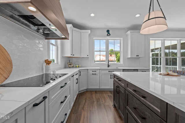 321 Bud Wall Rd, Youngsville, NC 27596 - kitchen featuring wall chimney exhaust hood, black electric stovetop, a sink, recessed lighting, and white cabinets