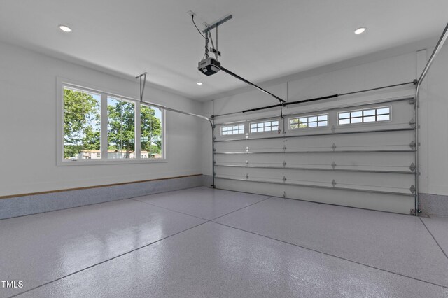 321 Bud Wall Rd, Youngsville, NC 27596 - garage with a garage door opener, recessed lighting, and baseboards