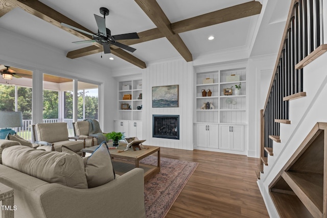 321 Bud Wall Rd, Youngsville, NC 27596 - living area featuring ceiling fan, wood finished floors, a fireplace, beamed ceiling, and stairway