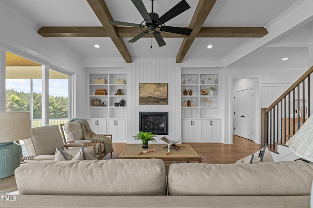 321 Bud Wall Rd, Youngsville, NC 27596 - living room with wood finished floors, beamed ceiling, coffered ceiling, a large fireplace, and a ceiling fan