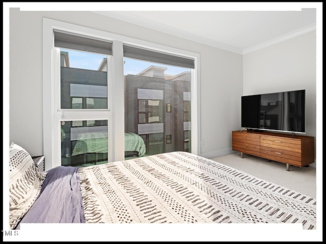 bedroom with ornamental molding, carpet flooring, and ensuite bathroom