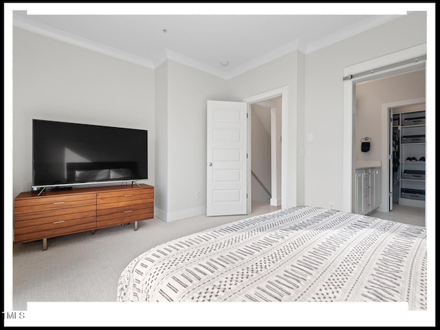 bedroom featuring light carpet, crown molding, and a barn door