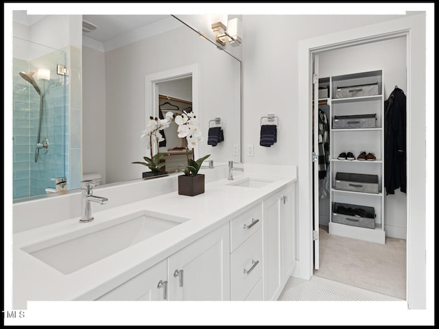 bathroom with vanity, ornamental molding, and walk in shower