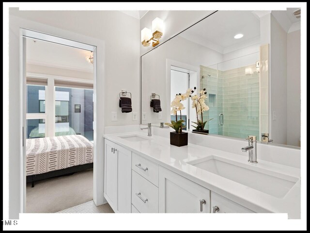 bathroom featuring vanity and an enclosed shower