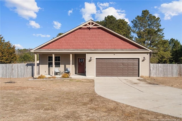 view of front of home with a garage and covered porch