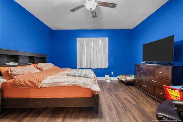 bedroom with hardwood / wood-style flooring and ceiling fan