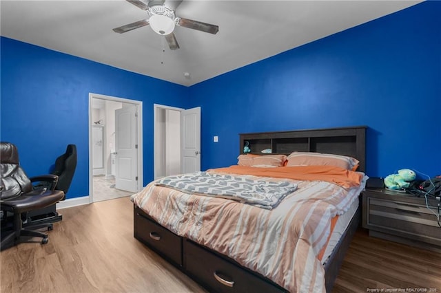 bedroom featuring light hardwood / wood-style floors and ceiling fan