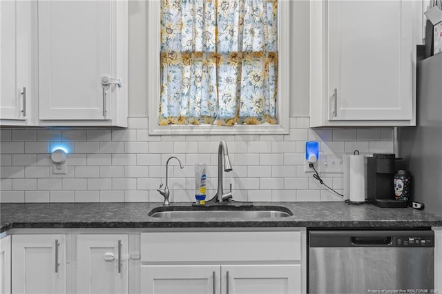 kitchen with sink, backsplash, white cabinets, and dishwasher