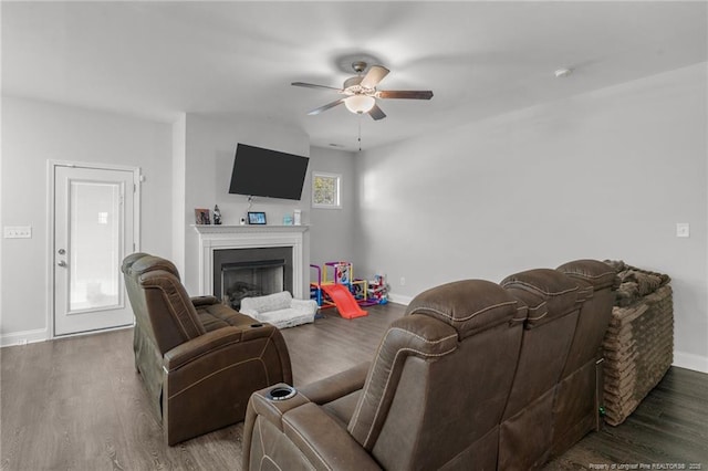 living room featuring ceiling fan and wood-type flooring