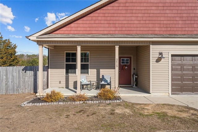 view of front of home with a porch and a garage