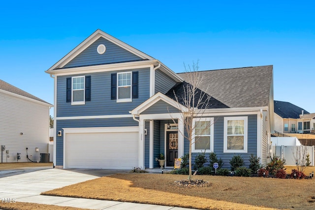 view of front facade with a garage and a front yard