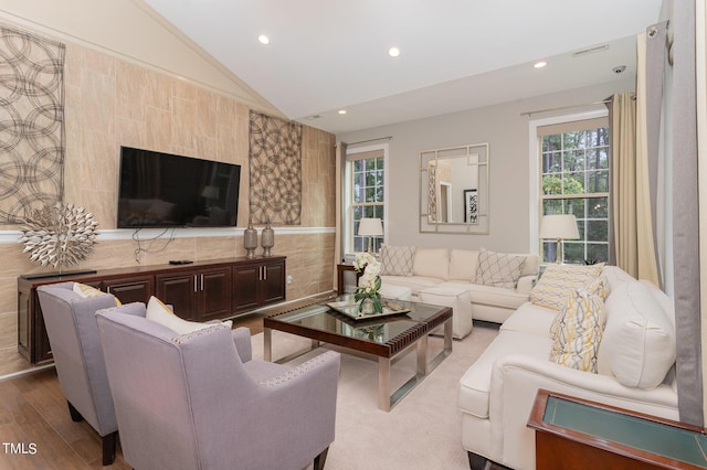 living room with hardwood / wood-style flooring and lofted ceiling