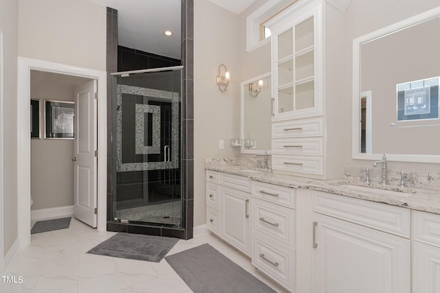 bathroom with vanity, toilet, and a shower with shower door