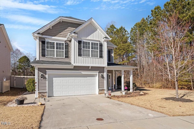 view of front of property featuring a garage, concrete driveway, and board and batten siding