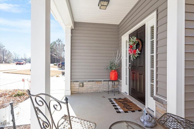 doorway to property with stone siding