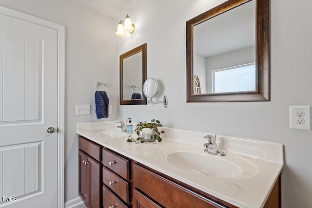 full bath featuring double vanity and a sink