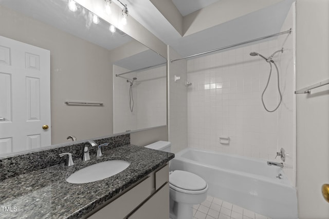 full bathroom with tiled shower / bath, vanity, toilet, and tile patterned flooring