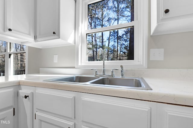 kitchen with sink and white cabinets