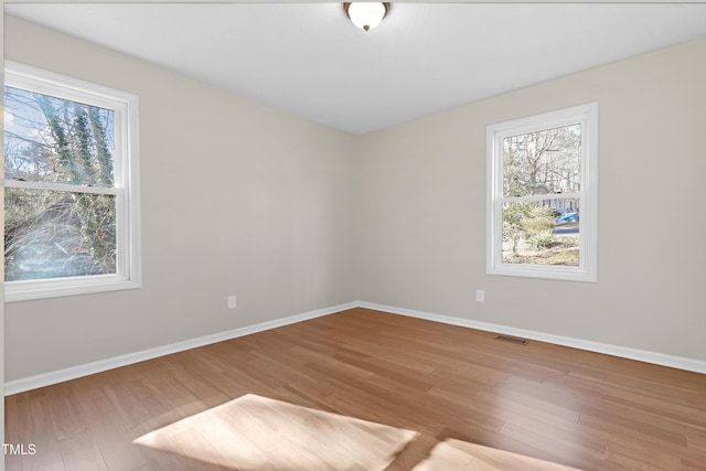 spare room featuring hardwood / wood-style flooring