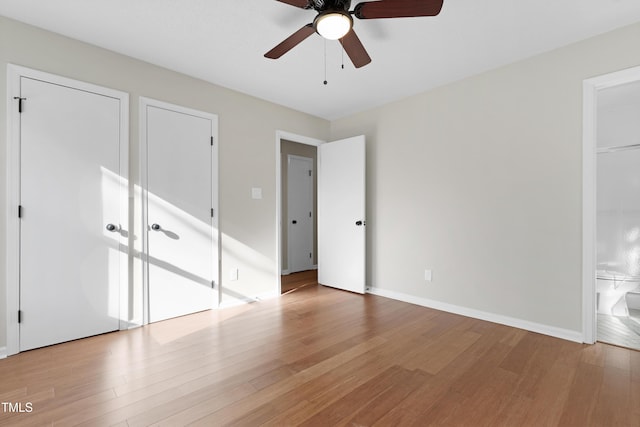 unfurnished bedroom with ceiling fan and light wood-type flooring