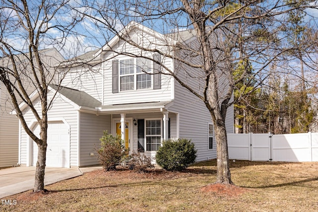 view of front property featuring a garage and a front yard