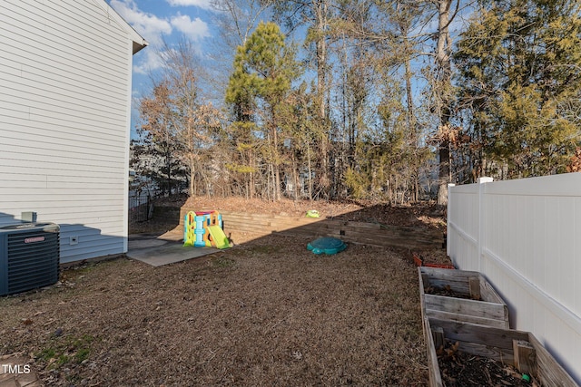 view of yard featuring central AC unit