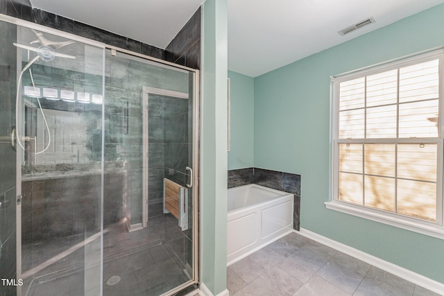 bathroom featuring independent shower and bath