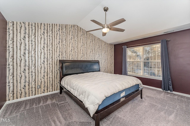 bedroom with lofted ceiling, ceiling fan, and carpet flooring