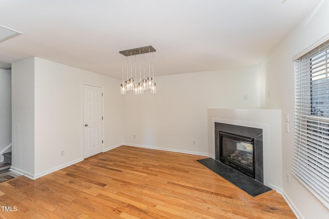 unfurnished living room featuring light hardwood / wood-style floors