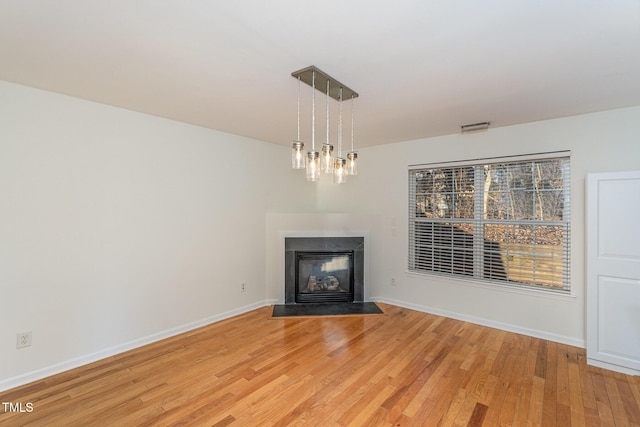 unfurnished living room featuring light hardwood / wood-style flooring