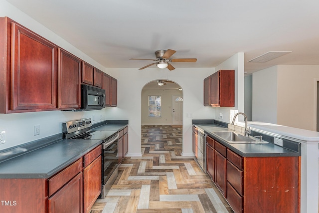 kitchen featuring sink, stainless steel range with electric cooktop, kitchen peninsula, ceiling fan, and light parquet flooring