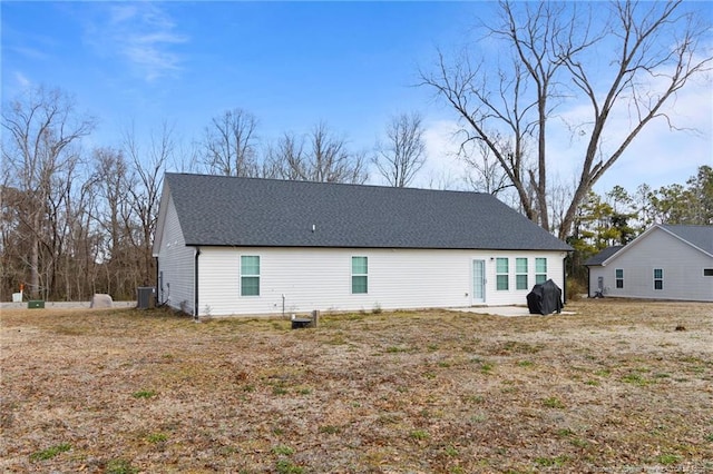 rear view of property featuring central AC and a patio area