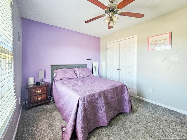 bedroom with dark carpet, a closet, and ceiling fan