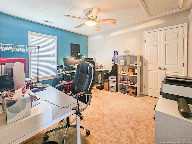 office with light carpet, a textured ceiling, and ceiling fan