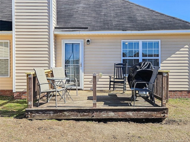 back of property with a deck