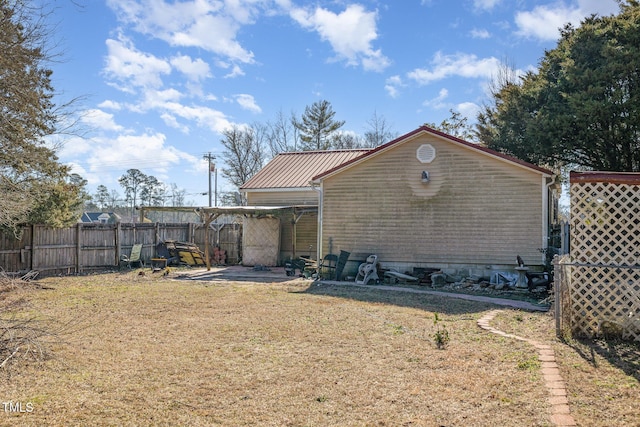 rear view of house with a yard