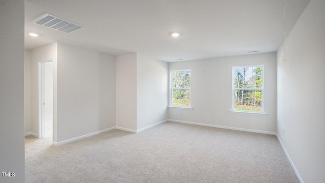 empty room with light colored carpet