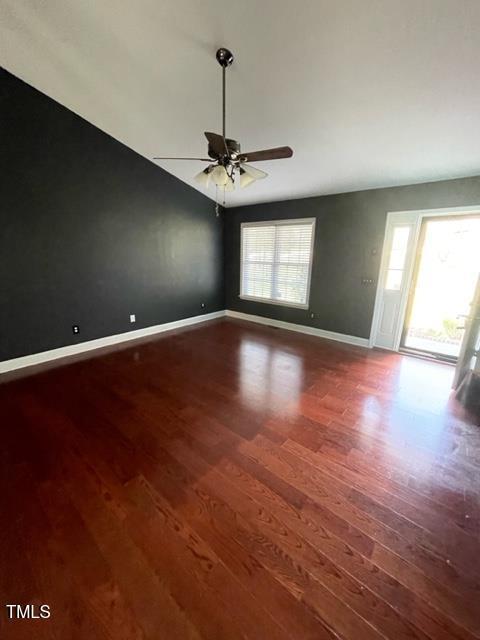 unfurnished room with hardwood / wood-style floors and ceiling fan