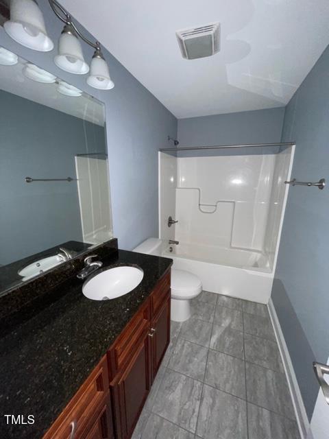 full bathroom featuring vanity, tub / shower combination, and toilet