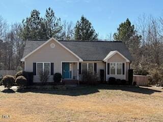 single story home featuring a front yard