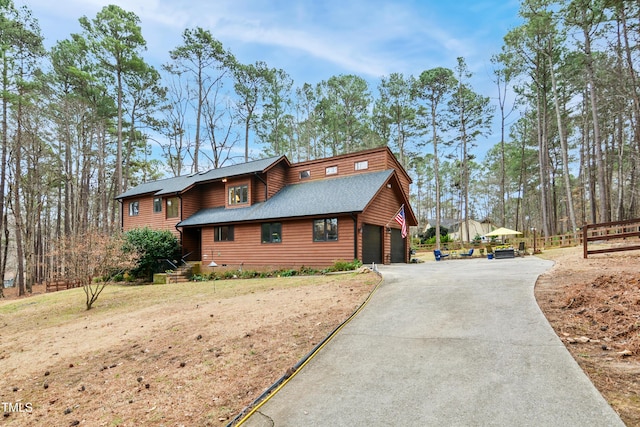 view of side of property featuring a garage