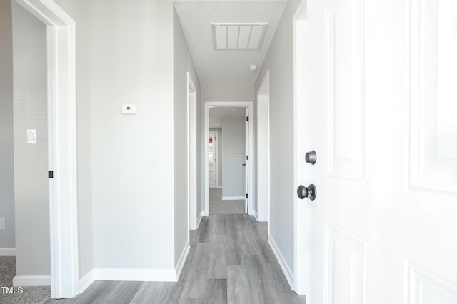 corridor featuring light hardwood / wood-style flooring