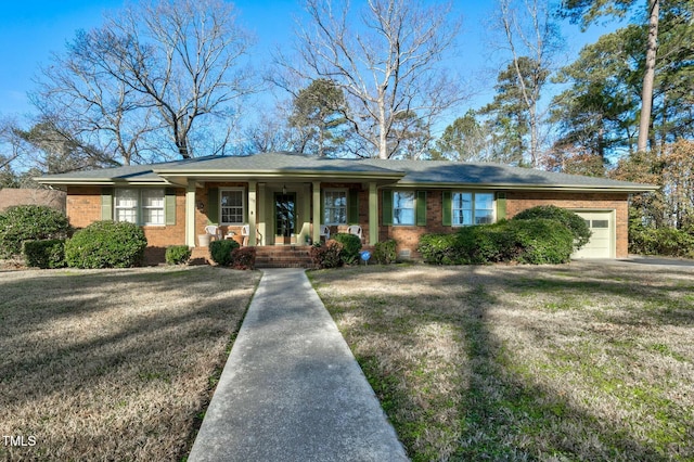 view of front of home with a garage and a front lawn