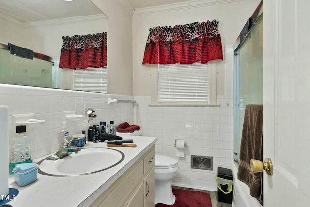 bathroom featuring an enclosed shower, vanity, ornamental molding, and toilet