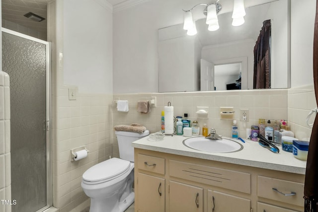 bathroom featuring toilet, an enclosed shower, tile walls, ornamental molding, and vanity