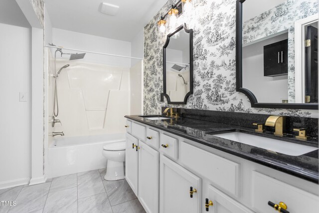 full bathroom featuring shower / bathtub combination, vanity, and toilet