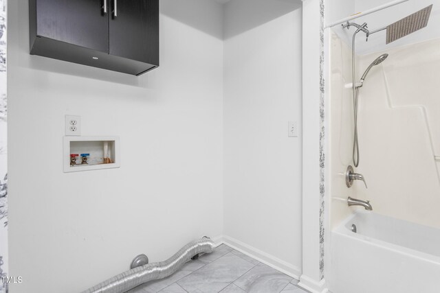 washroom featuring cabinets and washer hookup
