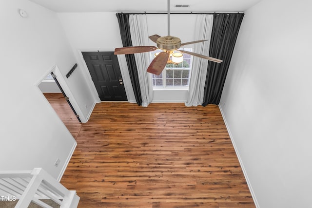 entrance foyer featuring wood-type flooring and ceiling fan
